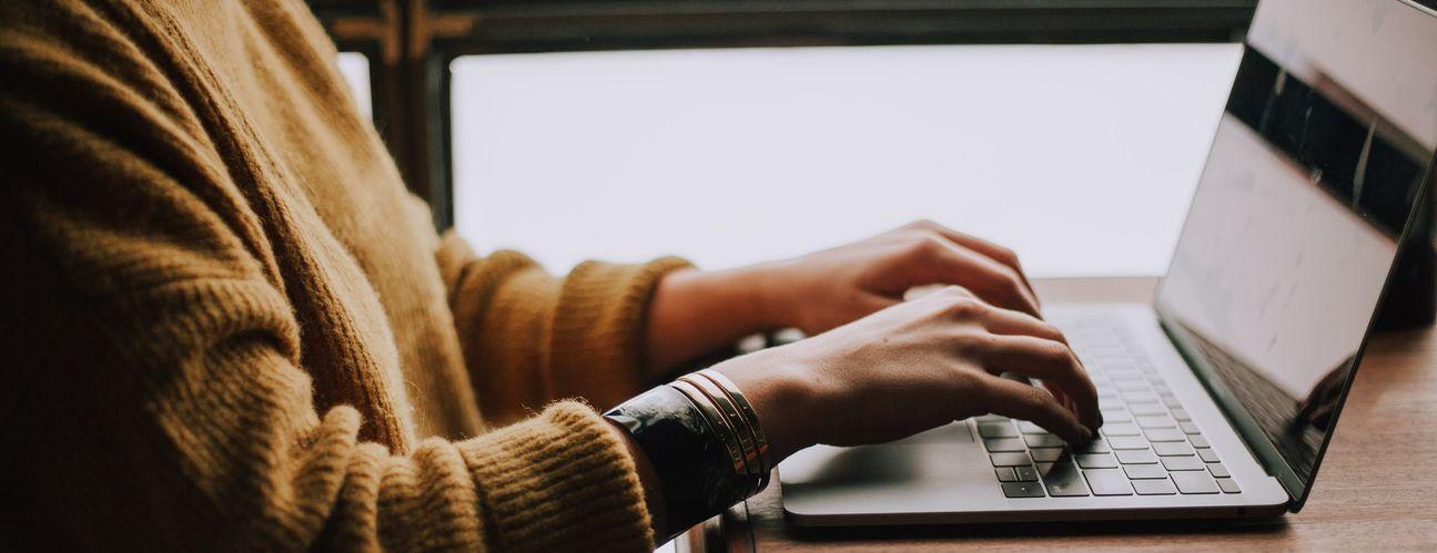 Woman typing on computer