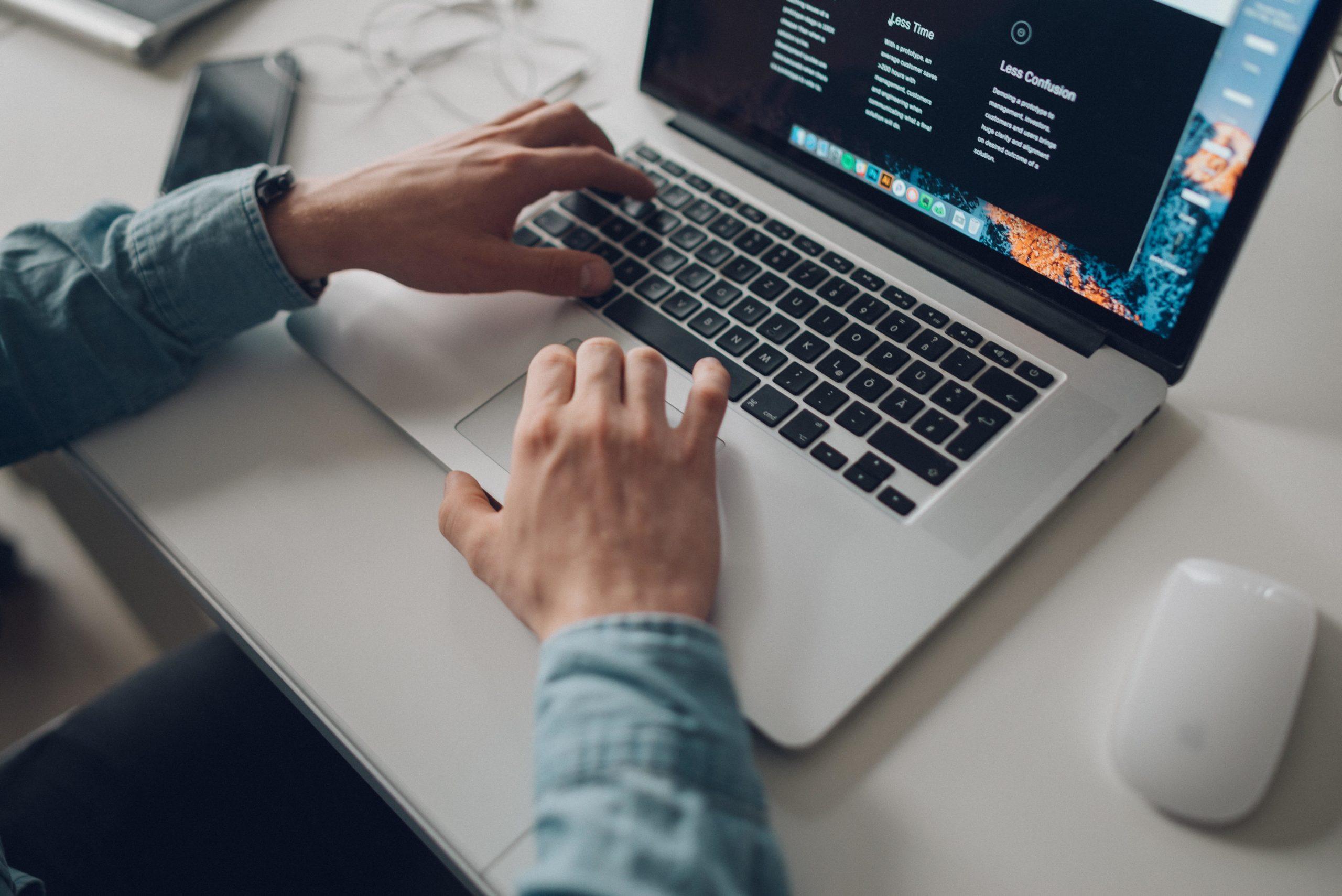 Person typing on computer