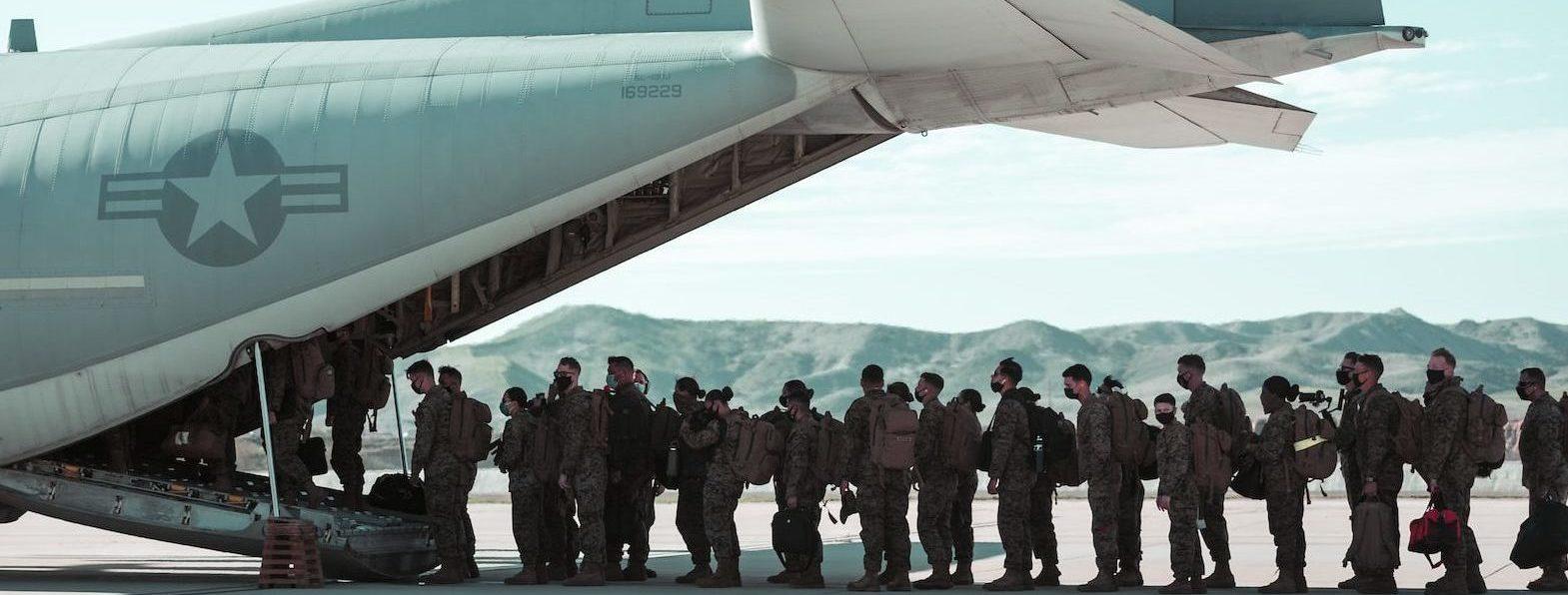 U.S. Marines boarding plane for deployment