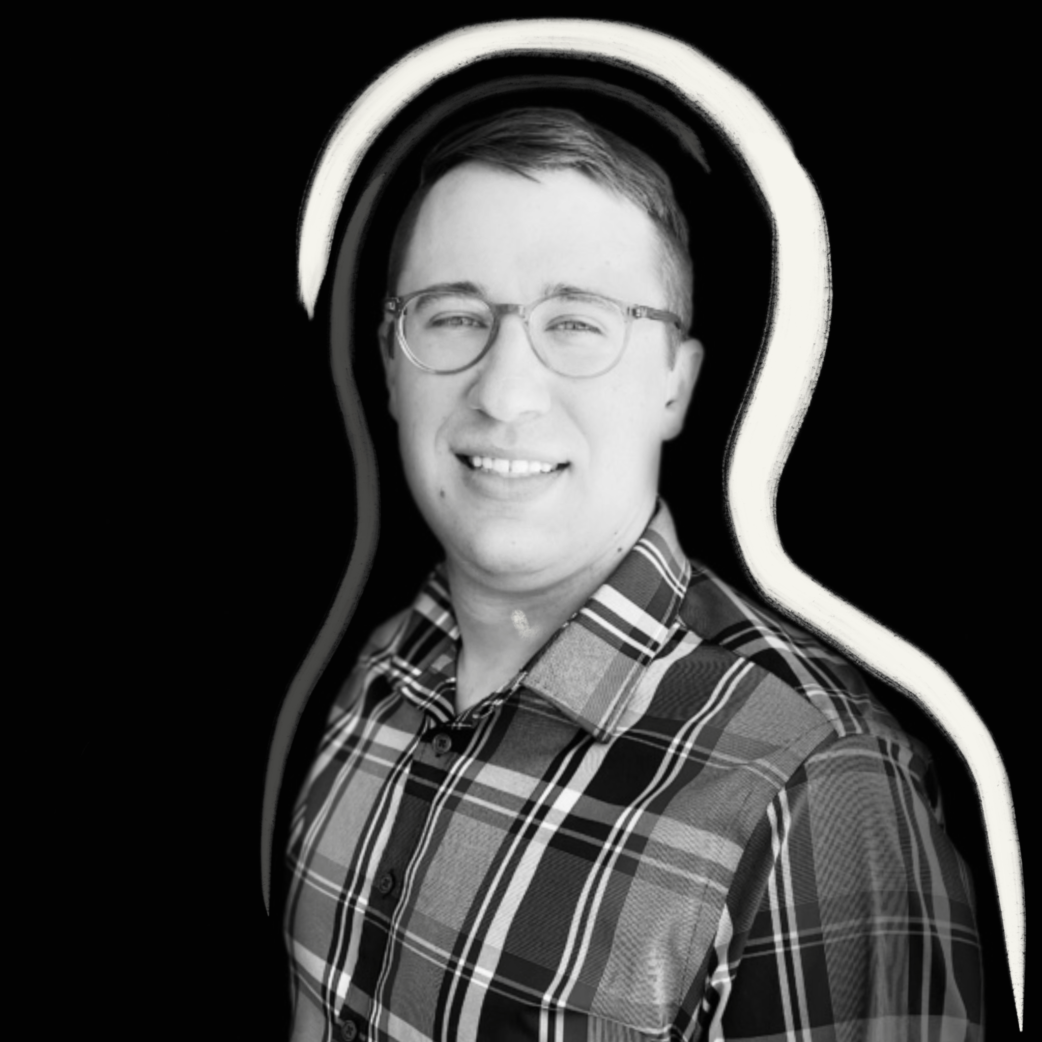 A person wearing glasses and a plaid shirt smiles at the camera. The background is solid black with a white outline drawn around their upper body and head. The image is in black and white.